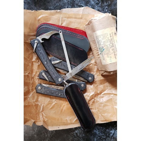 фотография трехпредметного ножа с пилкой производства СССР